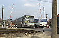 Wiima-K202 (Volvo-B10M) гос.# АХ8366BC 354-го маршрута в Дергачах на переезде 768 км.
