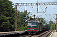 ВЛ82м-090 с грузовым поездом на перегоне Основа — Терновое проходит платформу 5 км