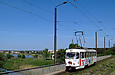 Tatra-T3SU #772 16-го маршрута на пробивке улицы Героев труда следует по мосту через реку Харьков
